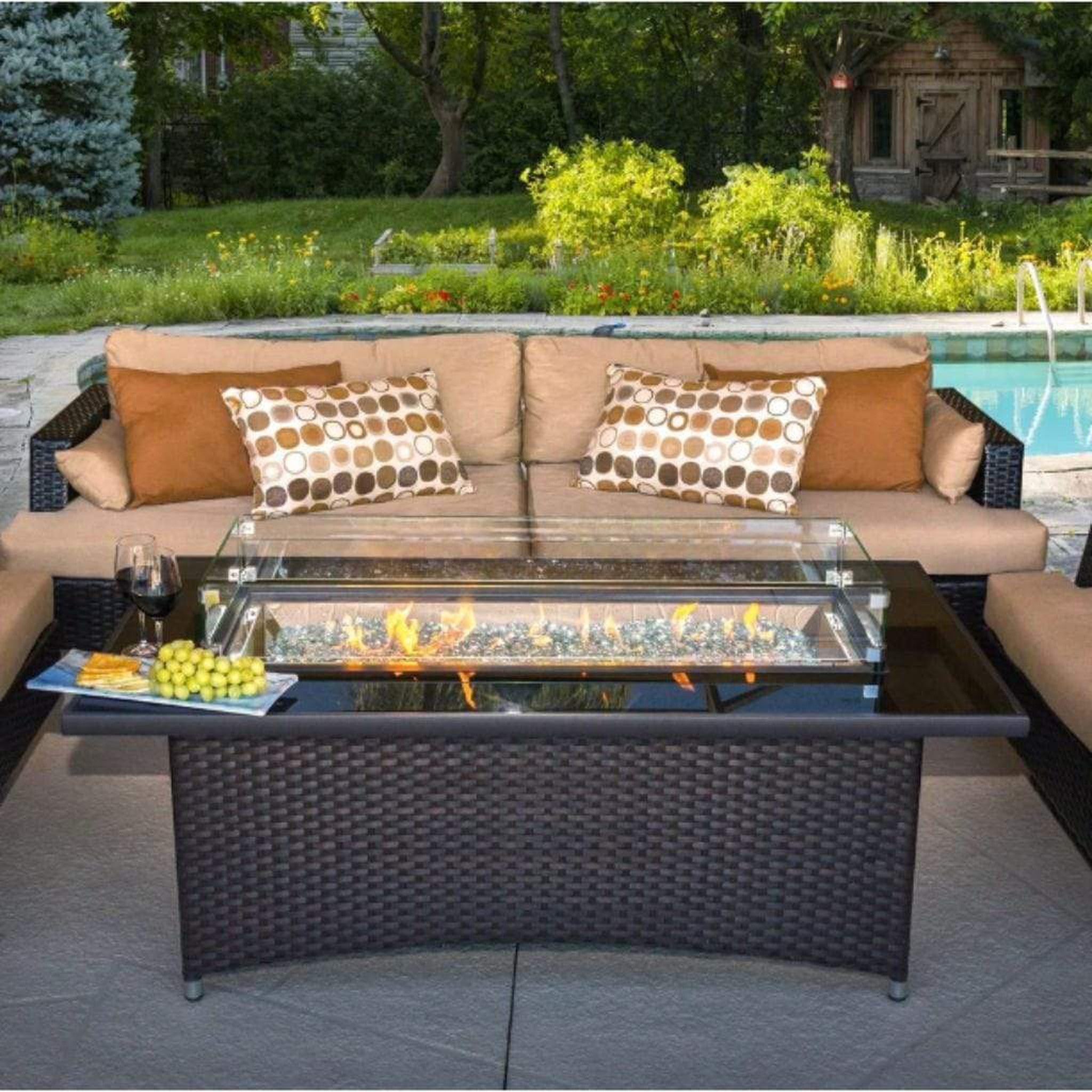 The Outdoor GreatRoom Company Montego 59" Balsam Resin Wicker Linear Gas Fire Pit Table with Black Glass Top
